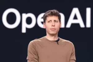 OpenAI के CEO सैम ऑल्टमैन बोले – “2026 तक AI इंसानों के साथ काम करने वाले वर्चुअल साथी बन जाएंगे”